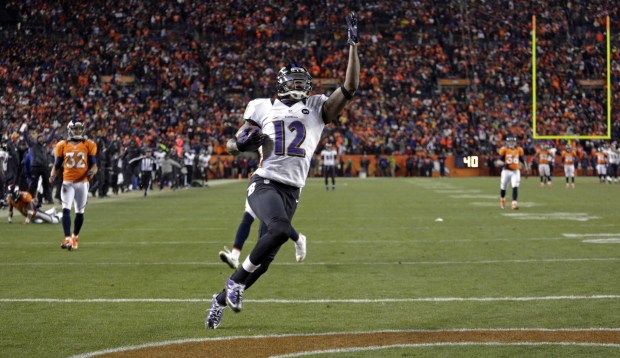 Ravens wide receiver Jacoby Jones celebrates as he crosses the ...