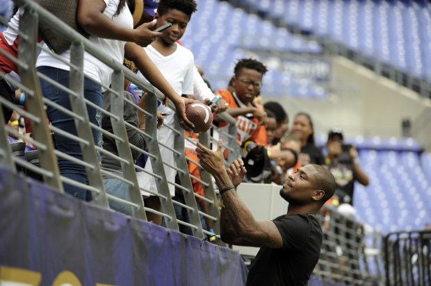 Baltimore, Md--8/12/17--Former Ravens wide receiver/returner Jacoby Jones signs autographs during the...