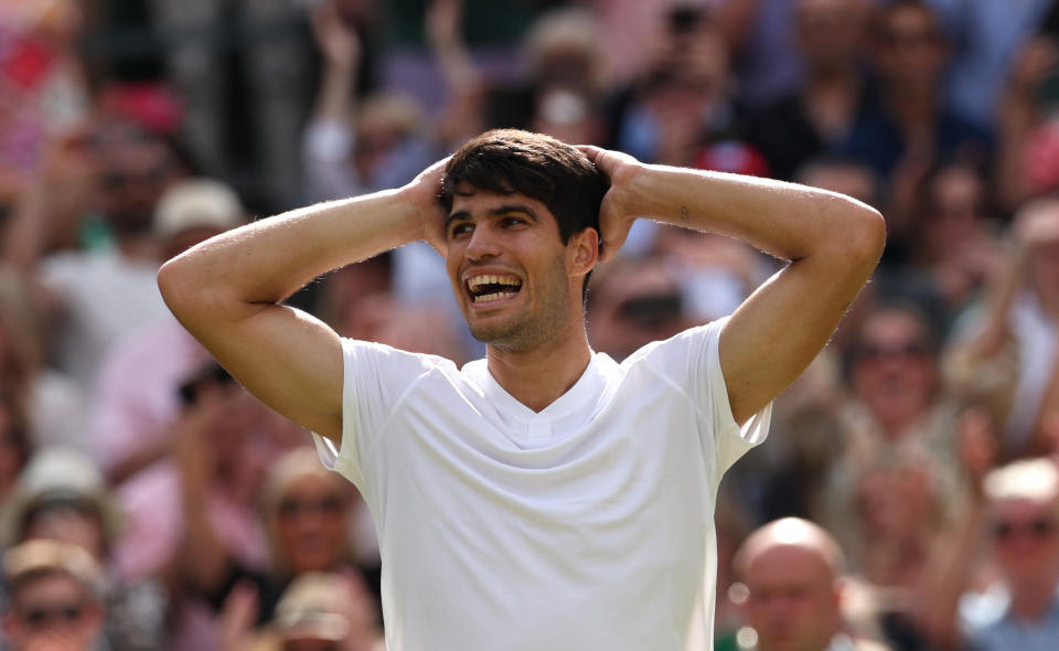 LONDON, ENGLAND - JULY 14: Carlos Alcaraz of Spain celebrates winning the Championship against Novak Djokovic of Serbia in the Gentlemen's Singles Final during the fourteenth day of The Championships Wimbledon 2024 at the All England Lawn Tennis and Croquet Club on July 14, 2024 in London, England.  .  (Photo by Clive Brunskill/Getty Images)